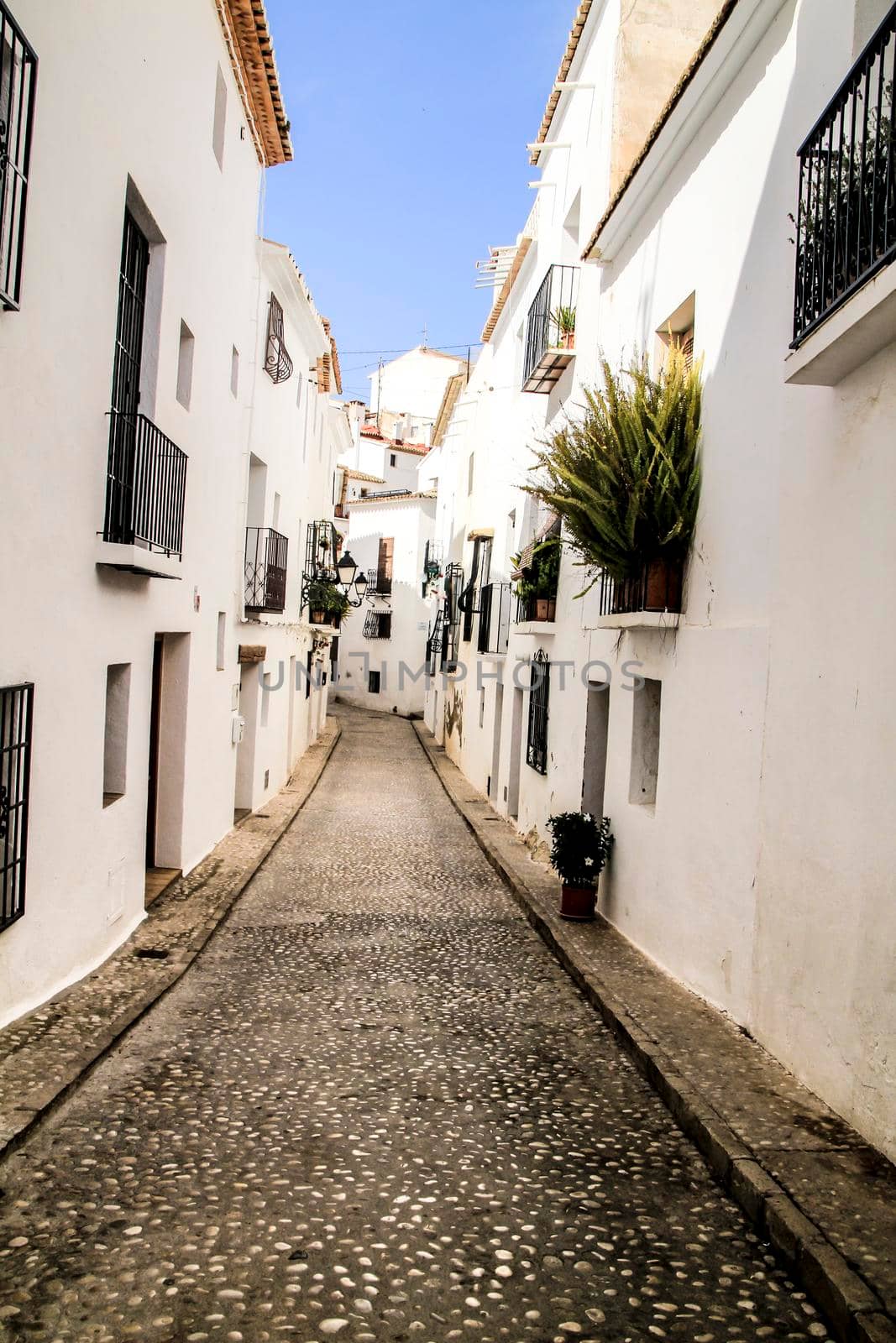 Narrow streets and beautiful whitewashed facades in Altea village, Alicante, Spain