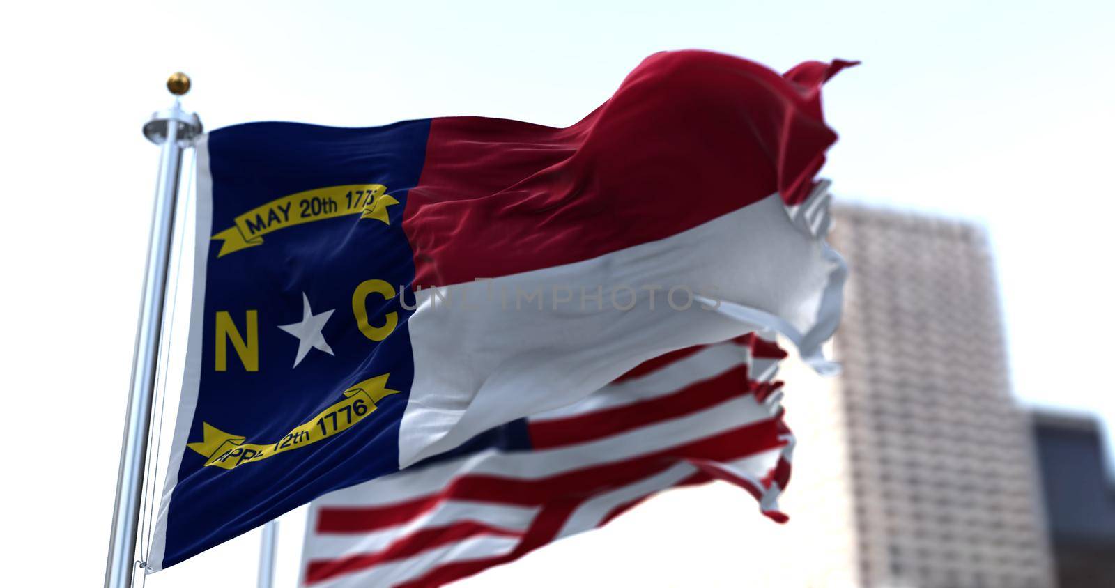 The flags of the Tennessee state and United States of America waving in the wind. Democracy and independence. American state.