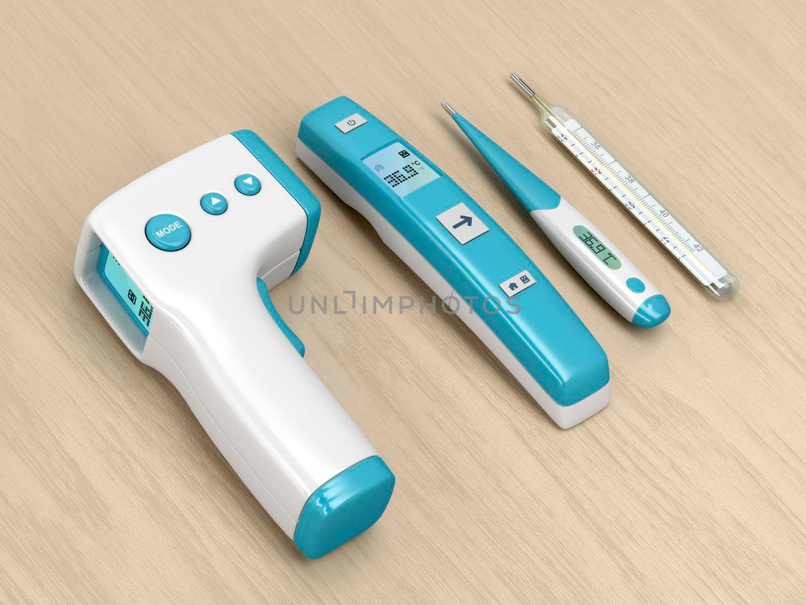 Four different types of medical thermometers on wood table