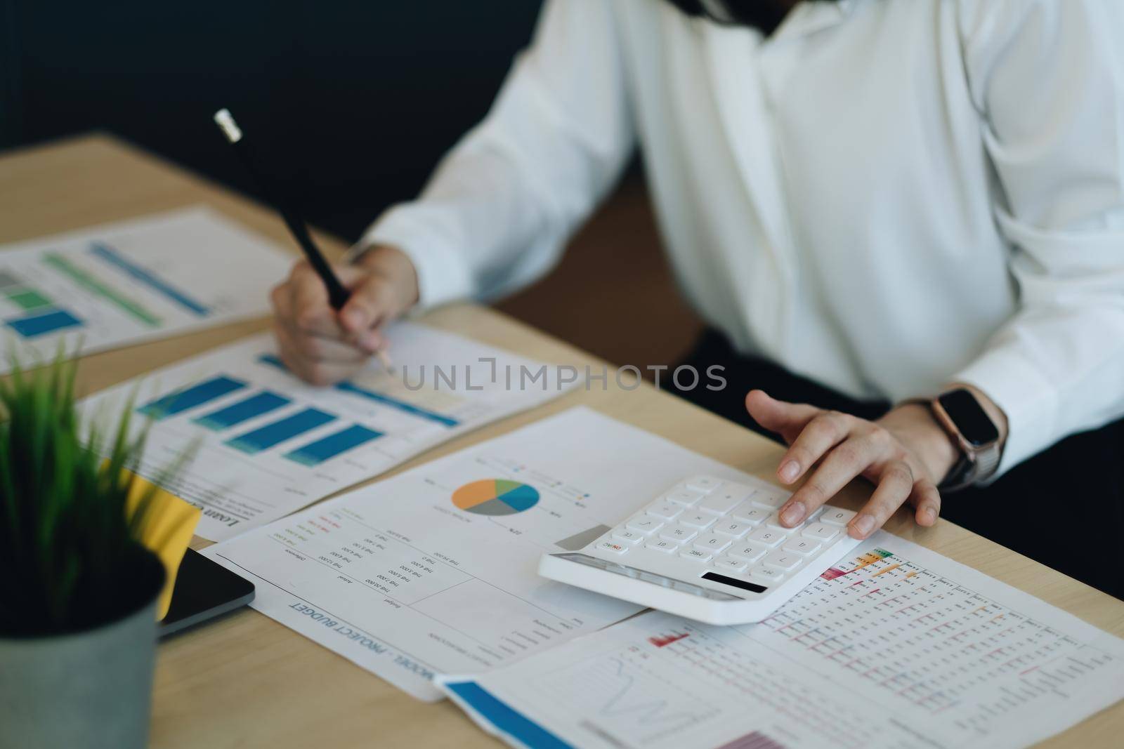 Business women using calculator with computer laptop, Business accounting, budget and loan paper in office