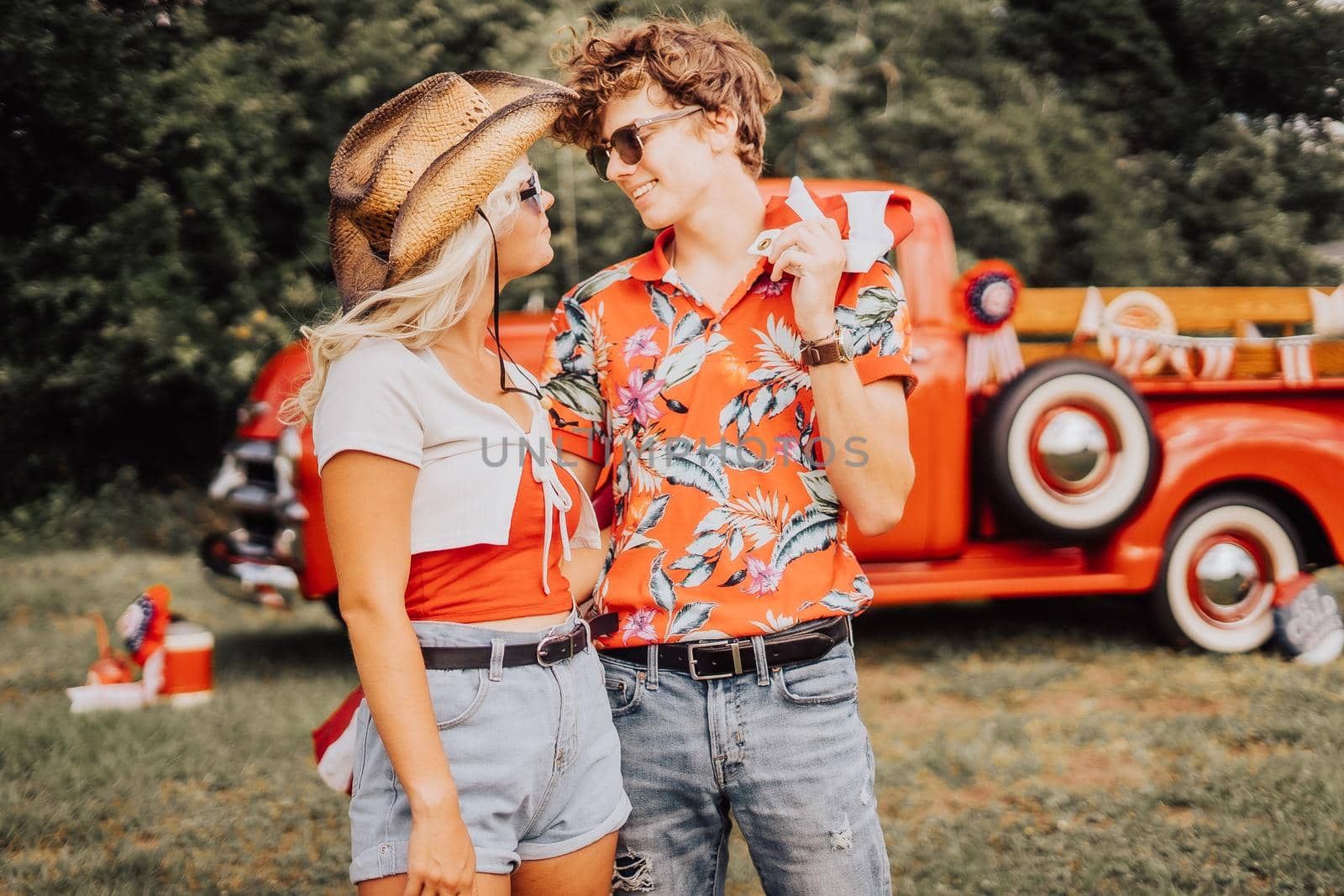 Couple in a vintage red truck