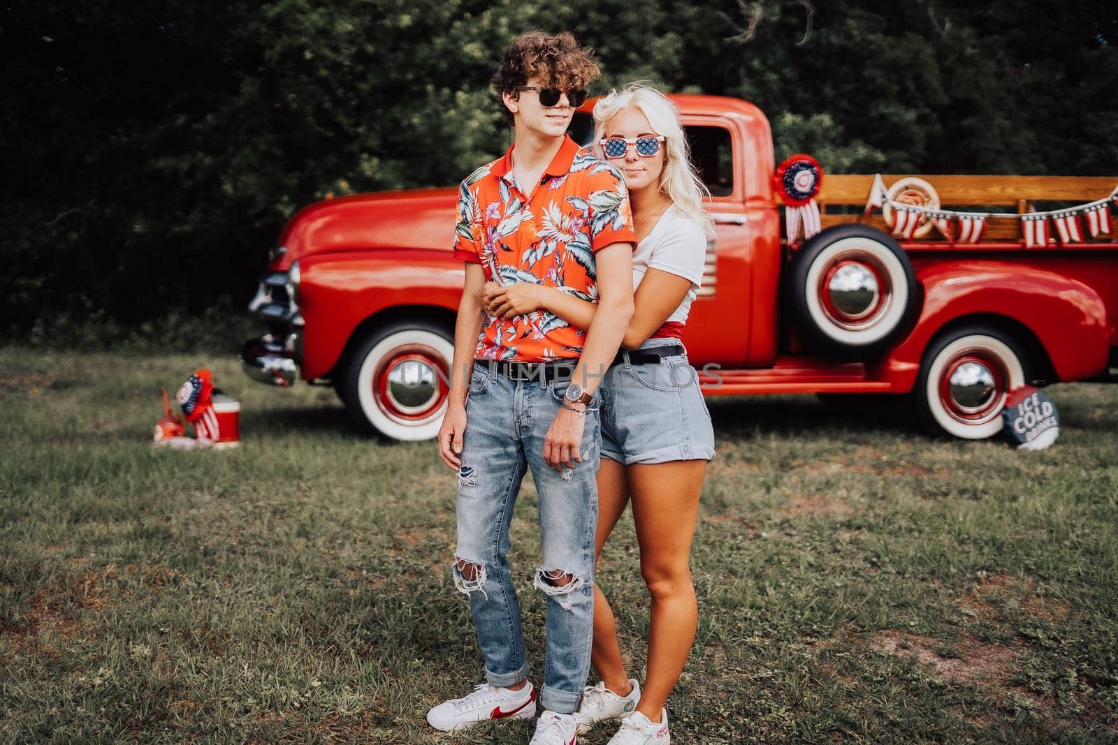 Couple in a vintage red truck