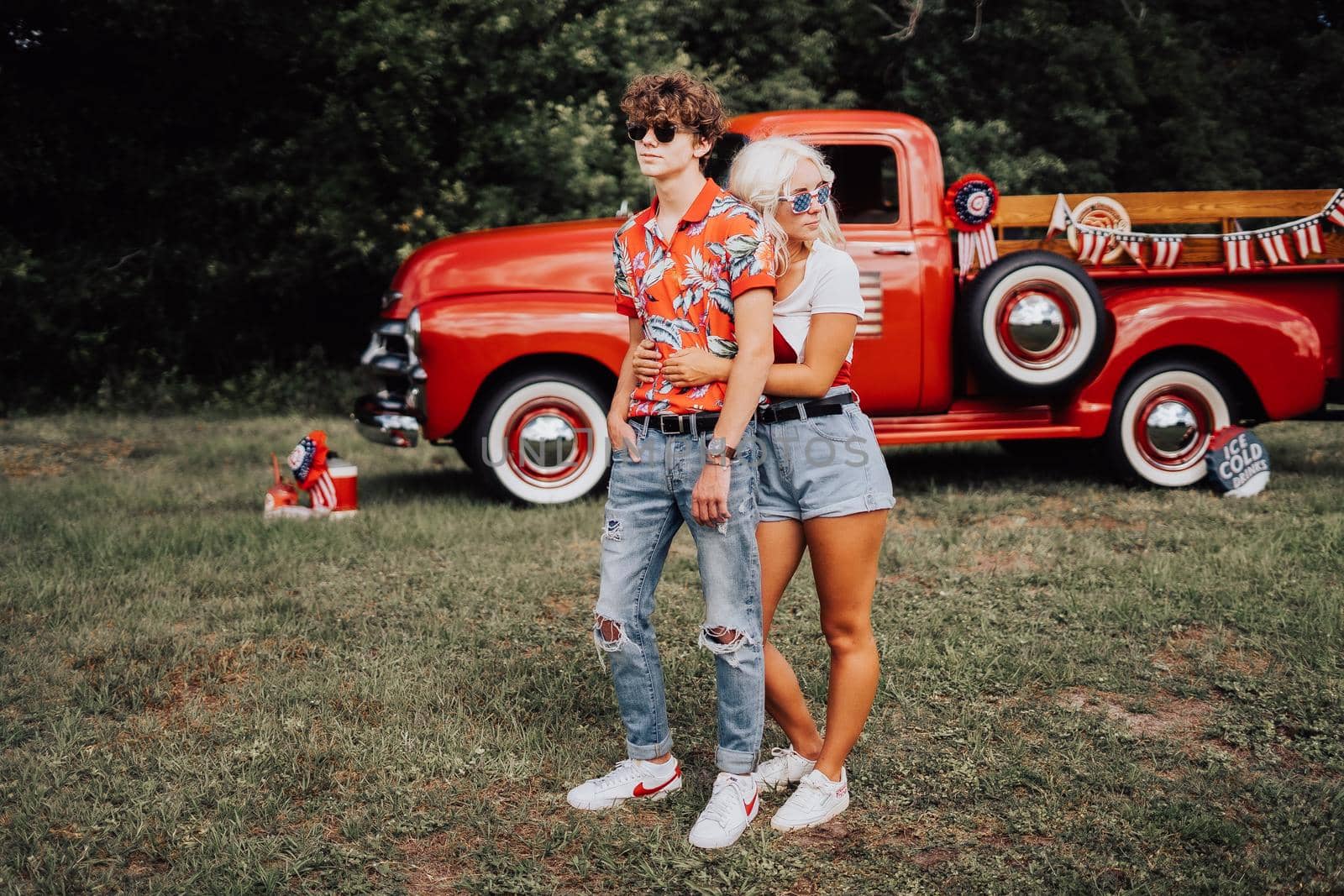 Couple in a vintage red truck