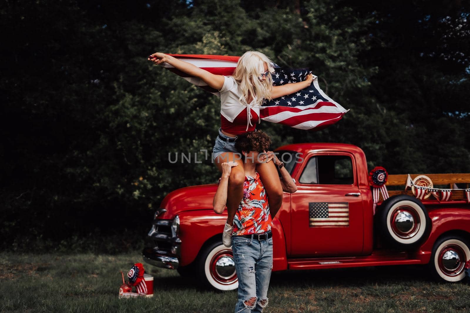 Couple in a vintage red truck