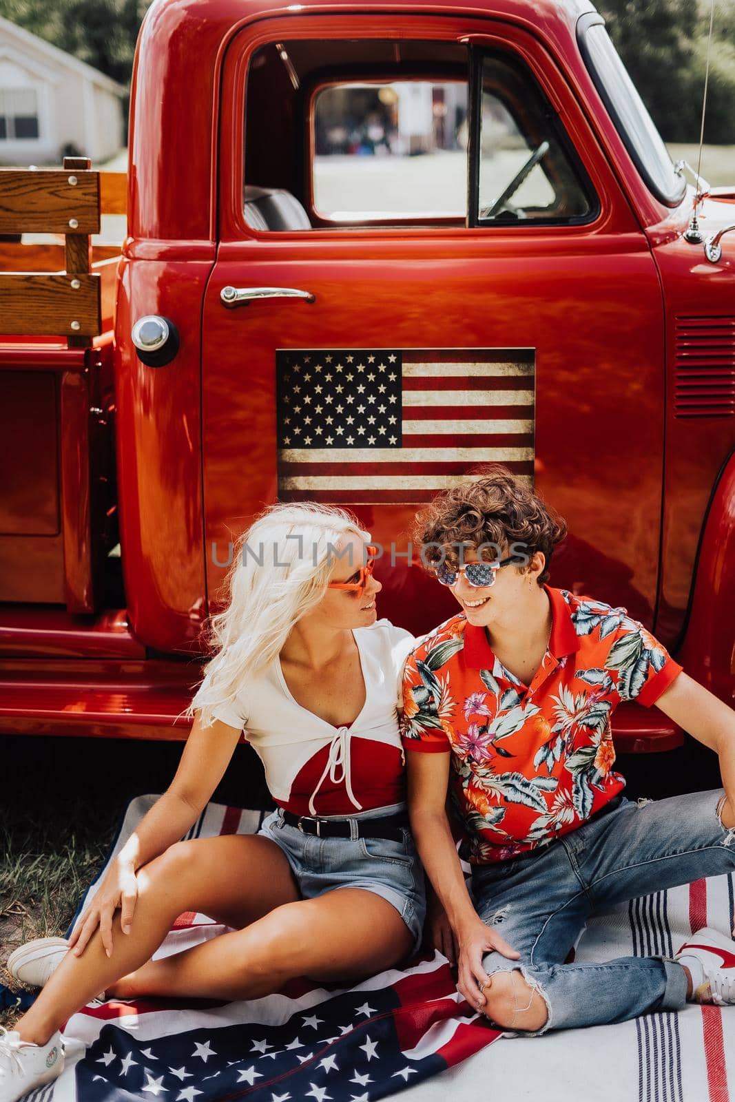 Couple in a vintage red truck