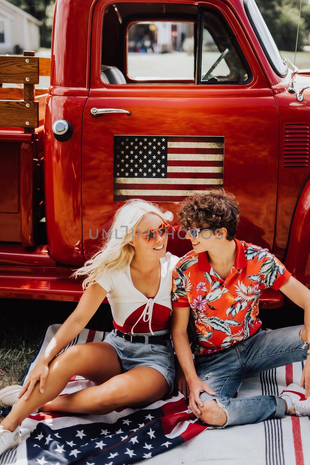 A couple with their vintage truck by castaldostudio