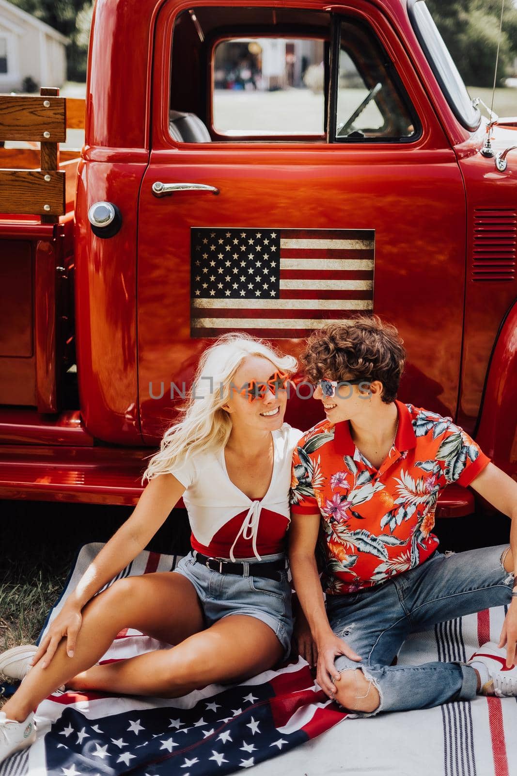 A couple with their vintage truck by castaldostudio