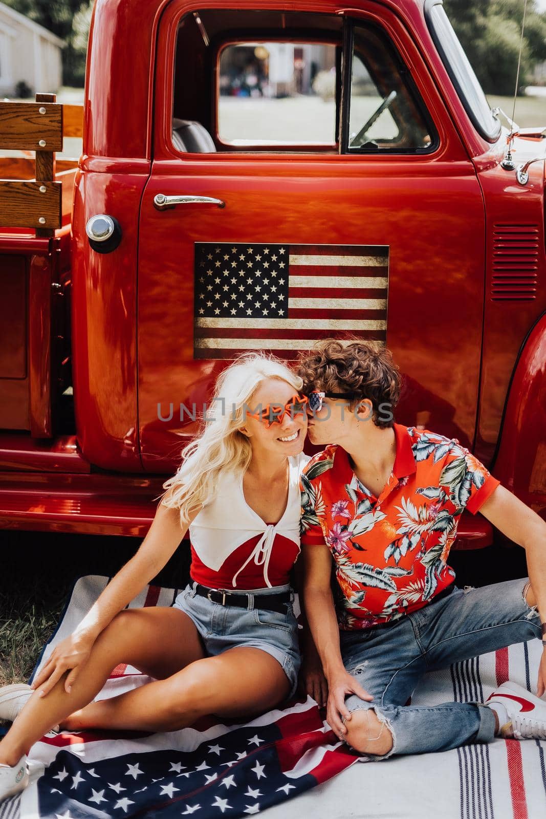 Couple in a vintage red truck