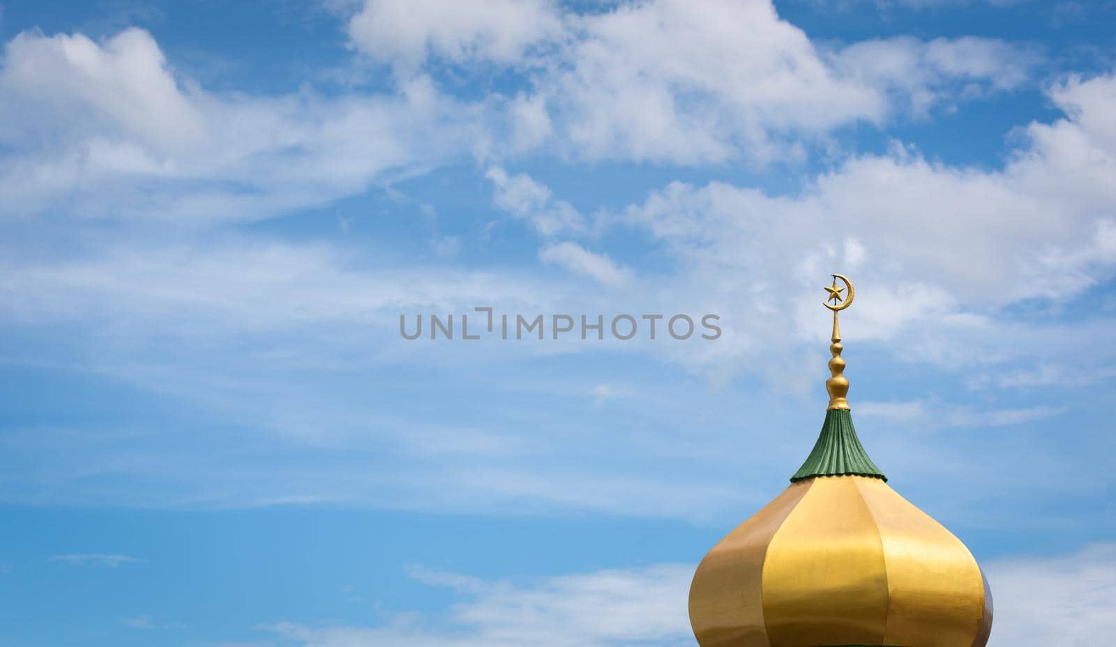 Moon and star of a Mosque with blue sky.