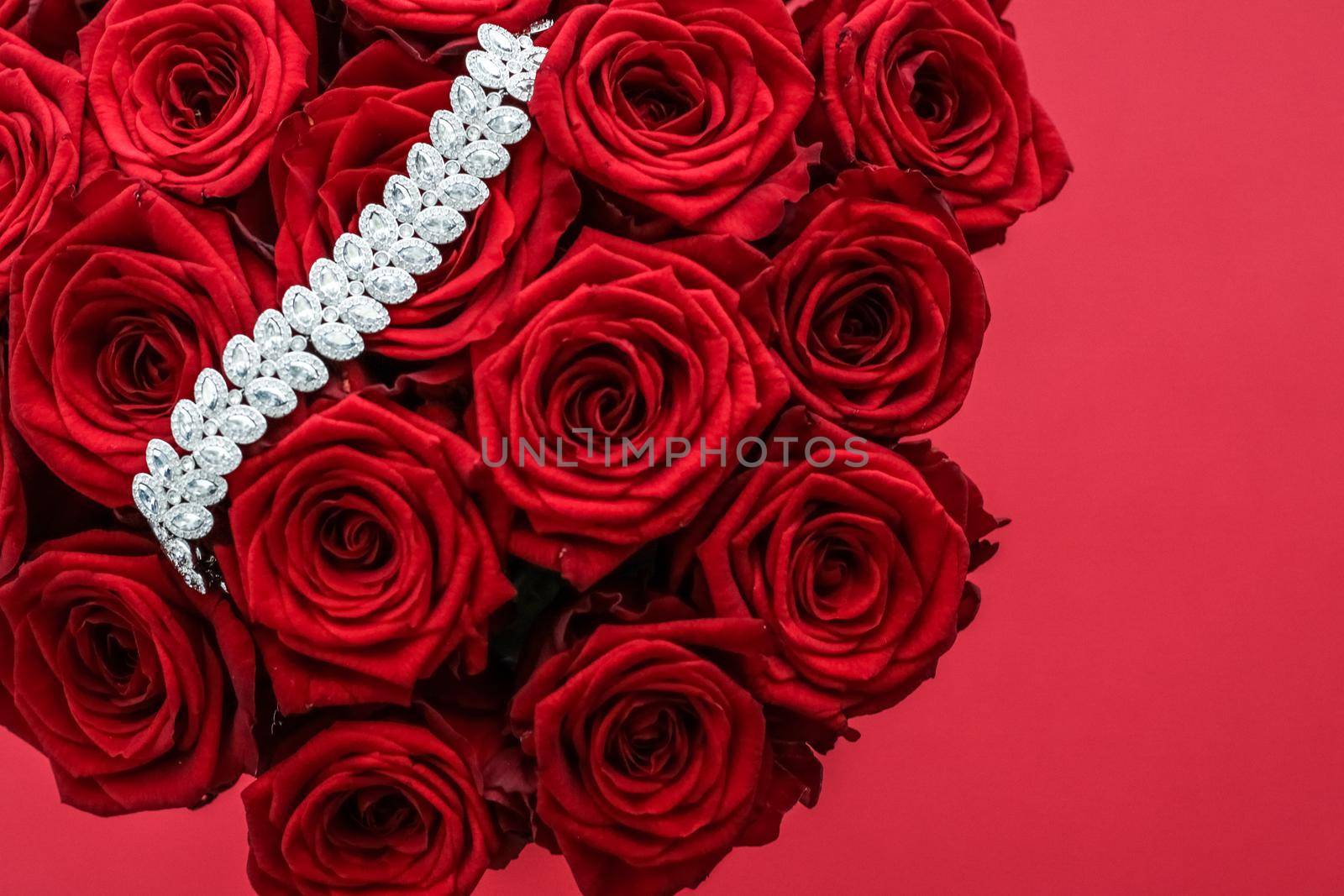 Gemstone jewellery, wedding fashion and luxe shopping concept - Luxury diamond bracelet and bouquet of red roses, jewelry love gift on Valentines Day and romantic holidays present