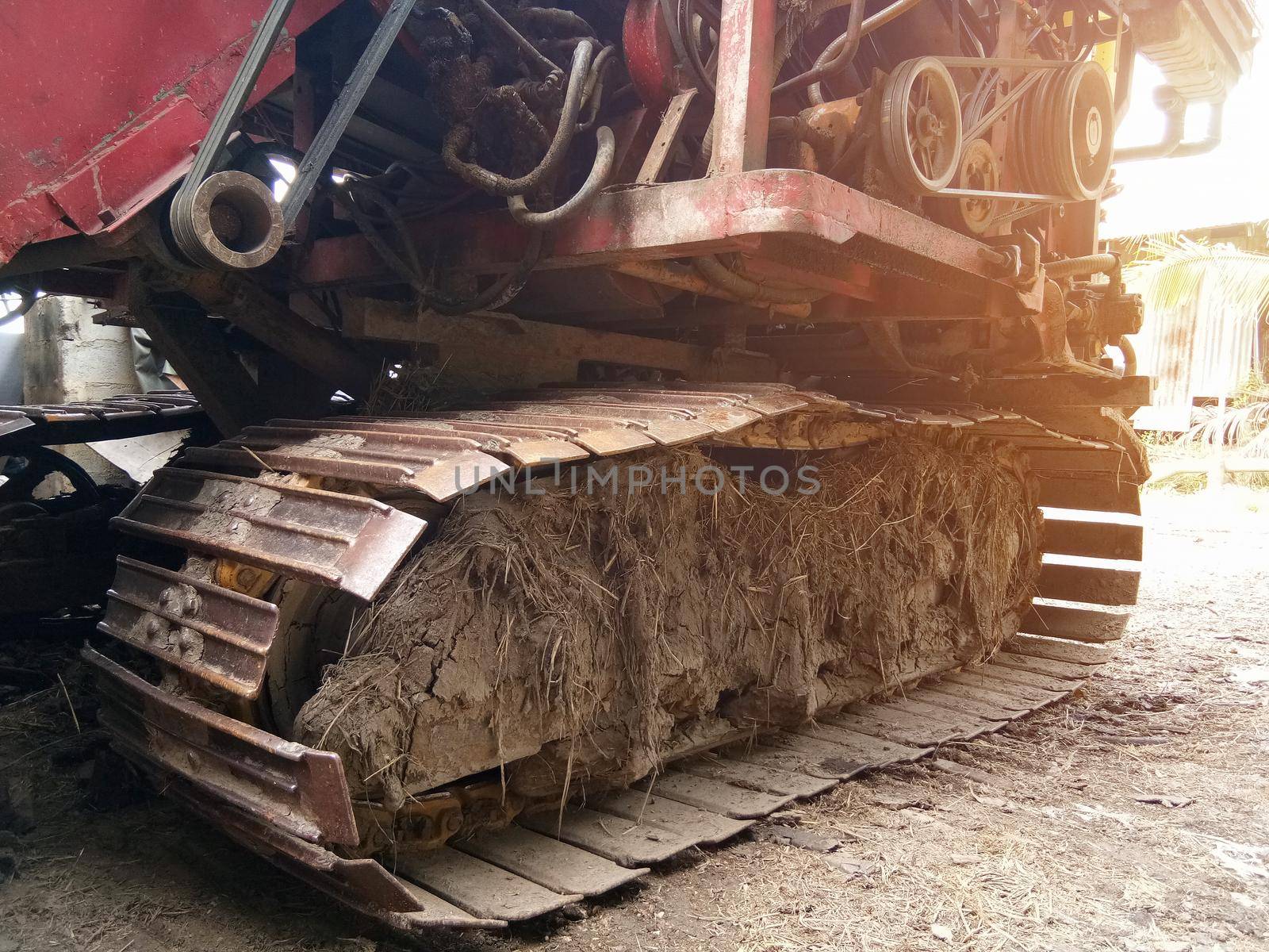 Close-up of Crawler tracks combine harvesters of The machine for harvesting from the fields.