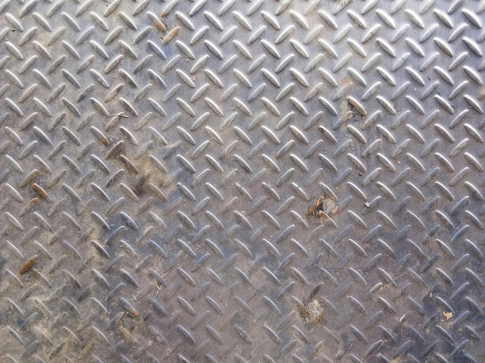 Old diamond iron plate texture background.