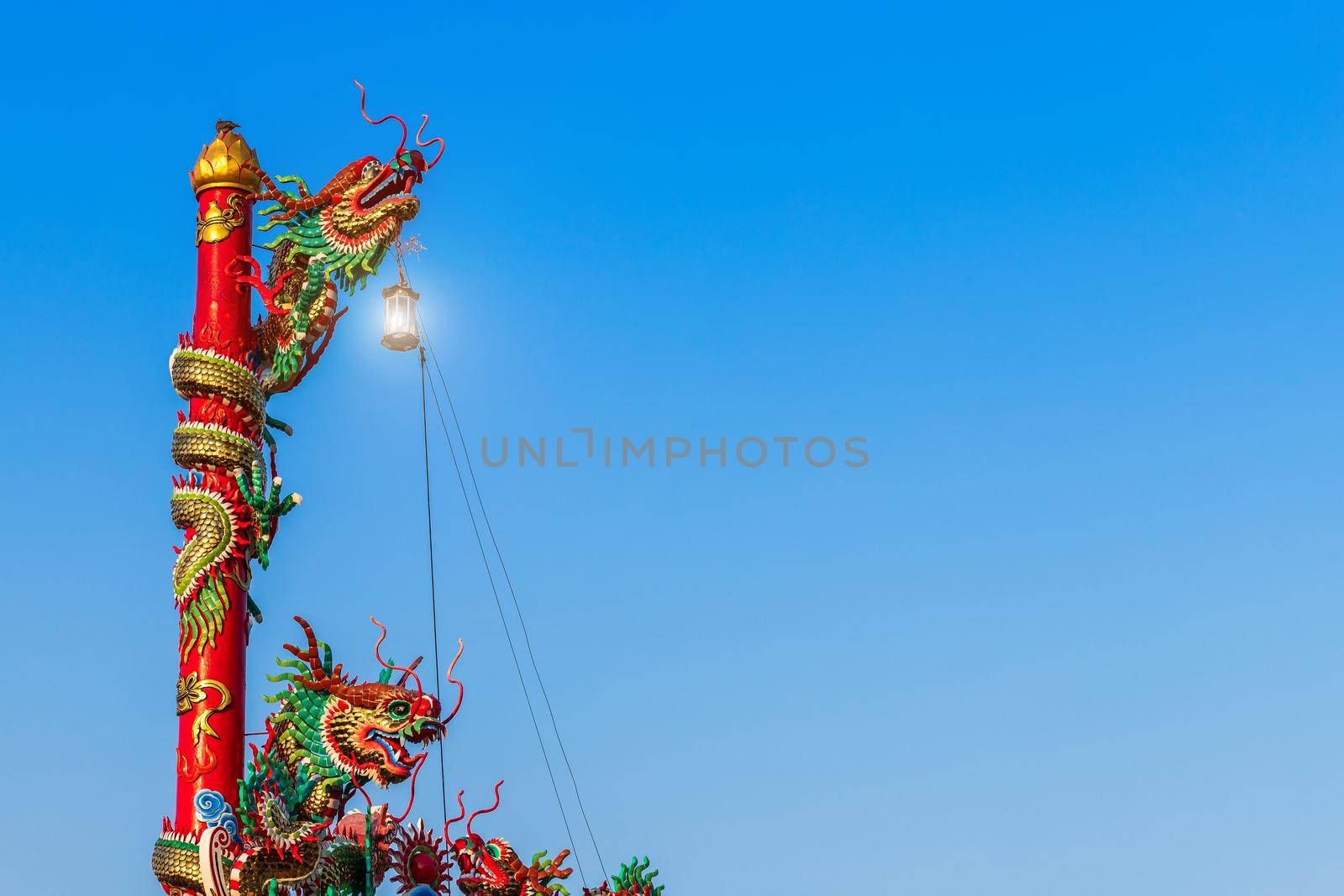 Beautiful Chinese dragons on a temple for Chinese New Year Festival at Chinese shrine with blue sky.