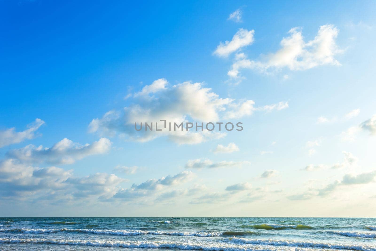 Beautiful early morning sunrise over the sea the horizon,blue sky background texture with white clouds sunset.