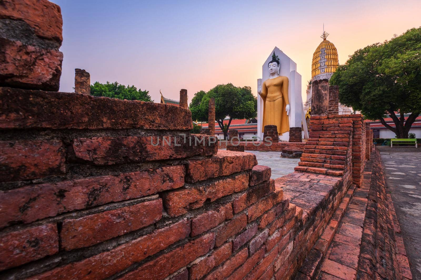 Buddha statue at sunset are Buddhist temple at Wat Phra Si Rattana Mahathat also colloquially referred to as Wat Yai is a Buddhist temple It is a major tourist attractions in Phitsanulok,Thailand.