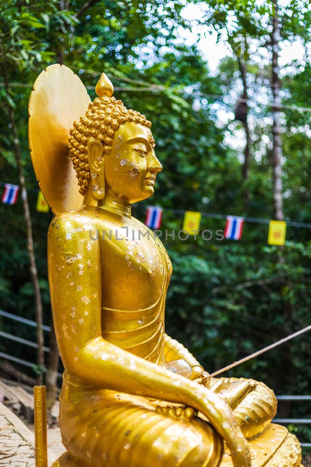 Buddha statue beautiful On the way up at The stone with the footprint of Lord Buddha at Khitchakut mountain It is a major tourist attraction Chanthaburi, Thailand.