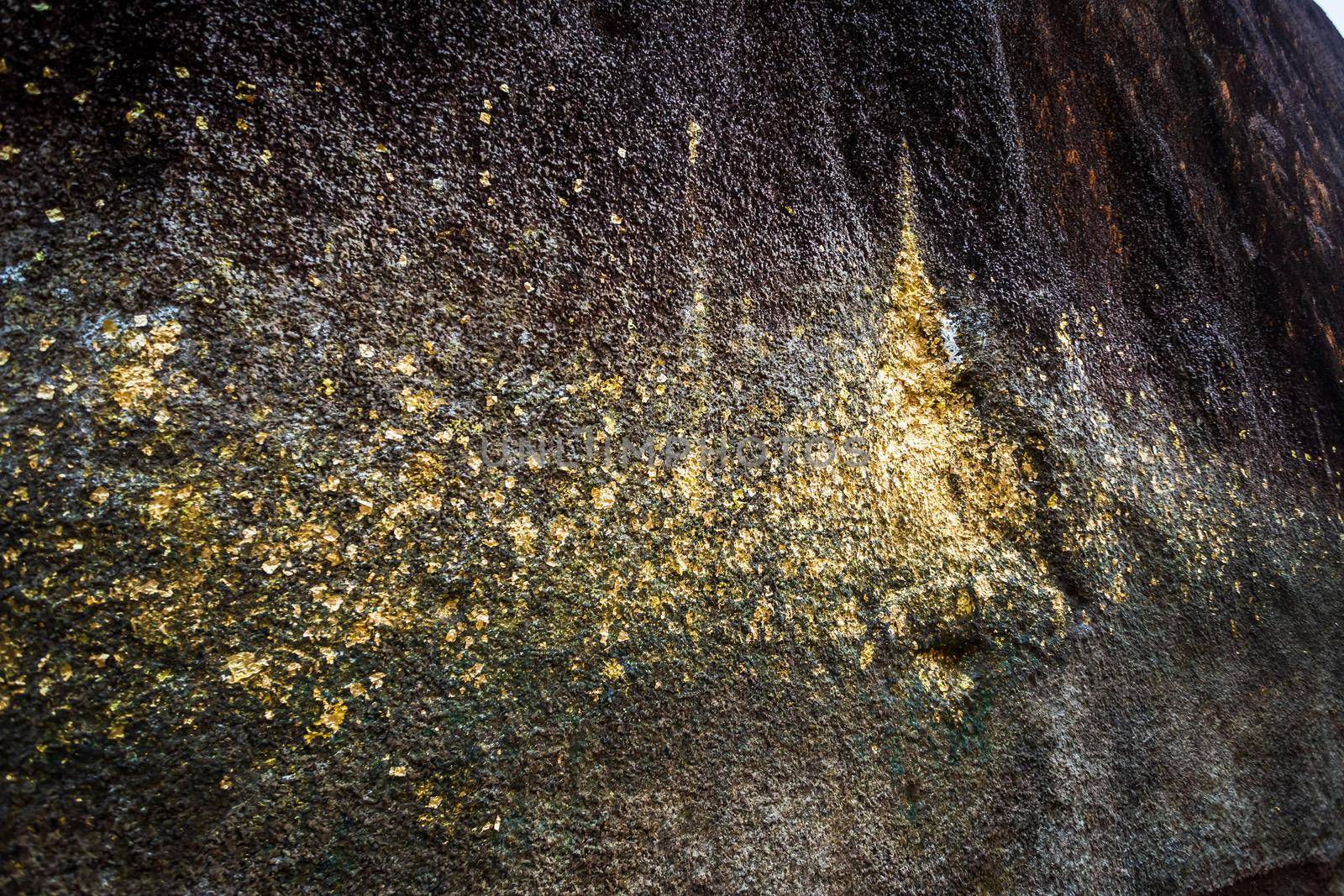 People traveling Gold Foil stick to worship The stone with the footprint of Lord Buddha at Khitchakut mountain It is a major tourist attraction Chanthaburi, Thailand.