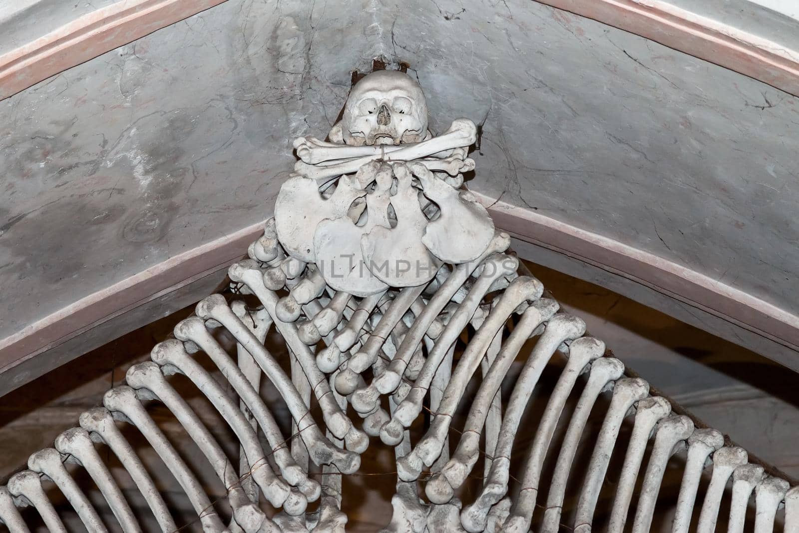 Kutna Hora, Czech Republic, February 19, 2014: Detail of a decoration composed of bones in the ossuary in Sedlec in Kutna Hora