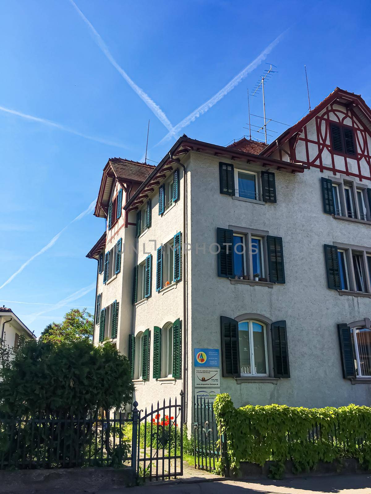 Richterswil, canton of Zurich, Switzerland circa June 2021: Historic building and house on street, Swiss architecture and real estate