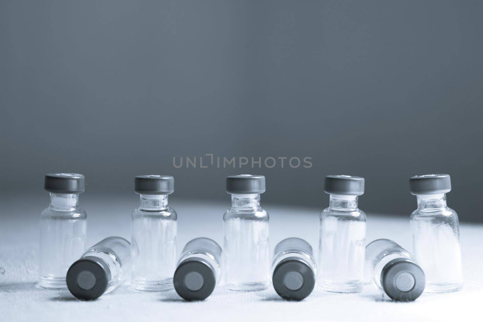 Empty glass jars of coronavirus vaccines. No people