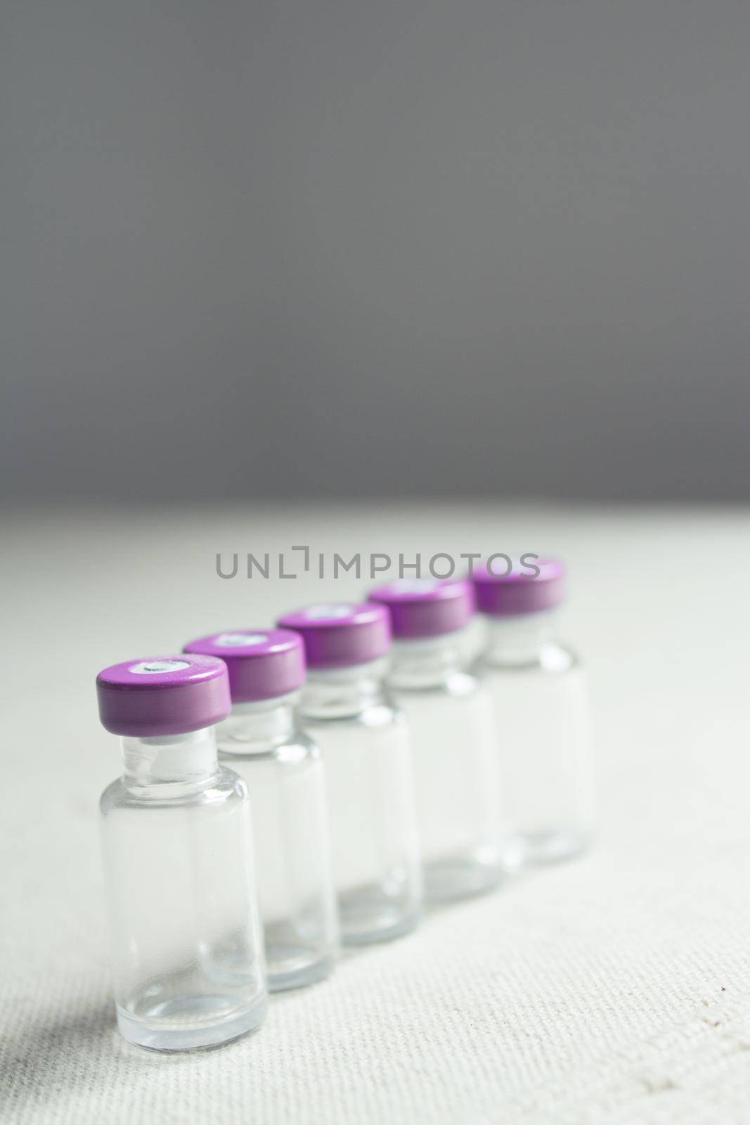 Empty glass jars of coronavirus vaccines. No people