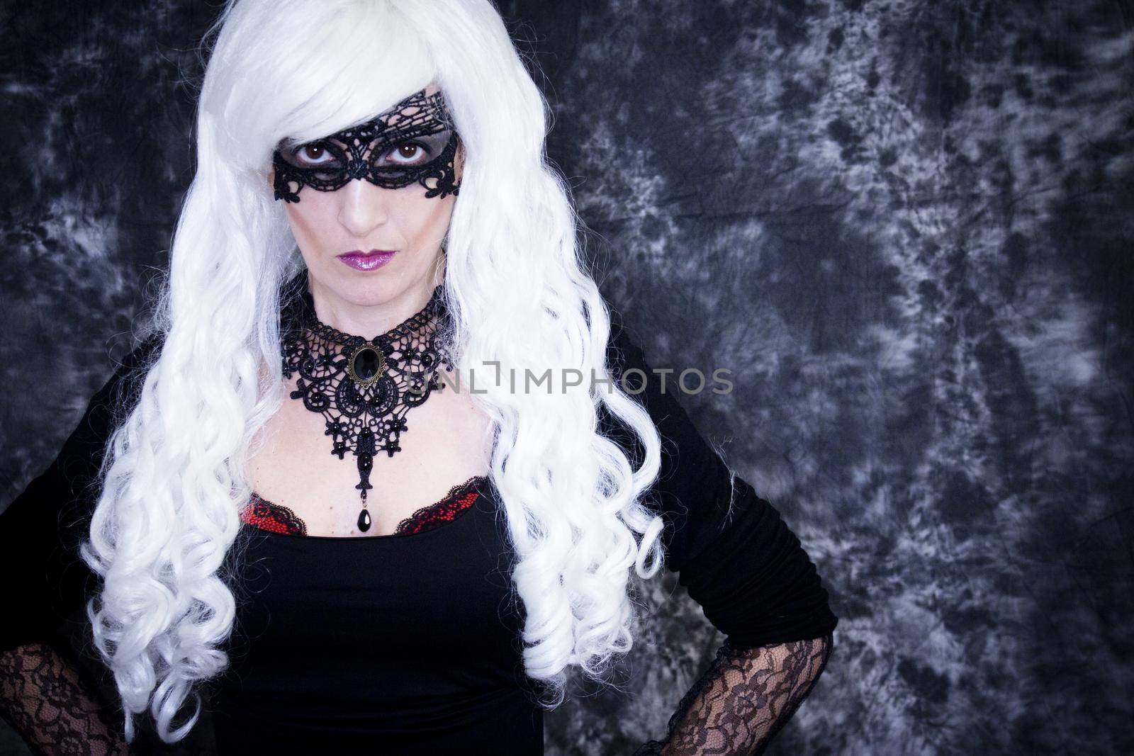 Woman disguised in gothic style for halloween party with mask