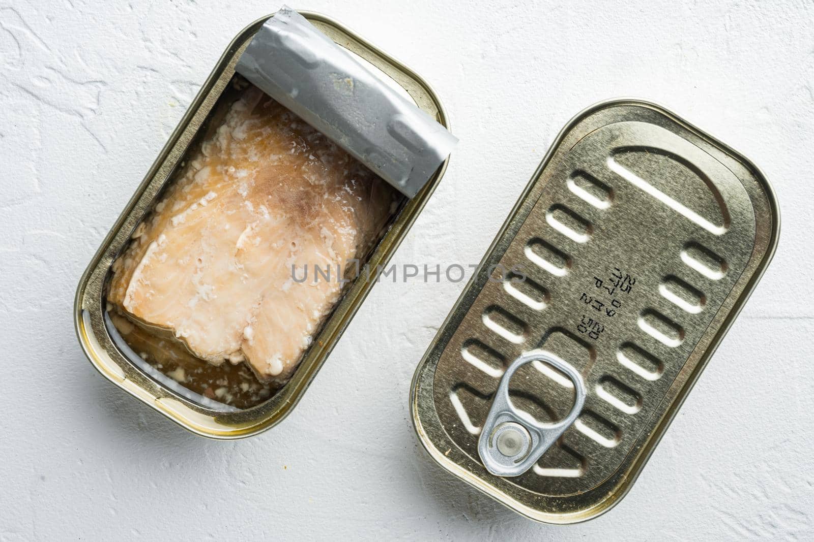 Canned Wild Alaska Salmon set, in tin can, on white background, top view flat lay