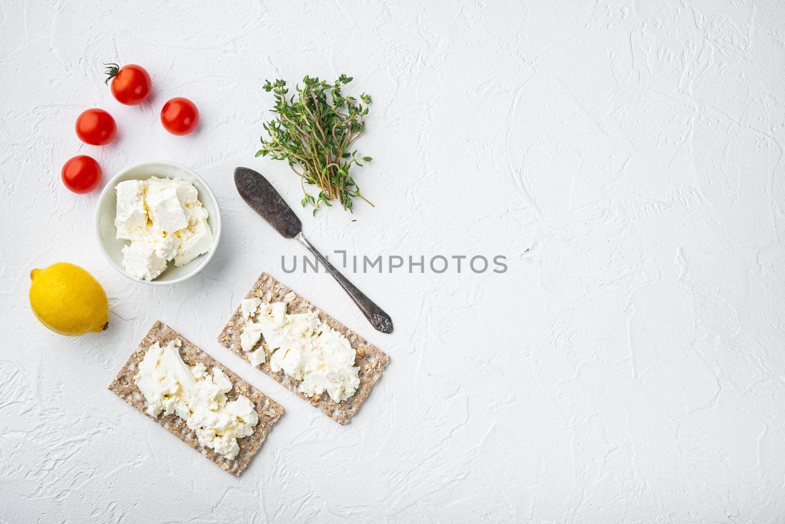 Crisp bread sandwich set, square format, on white stone table background, top view flat lay, with copy space for text