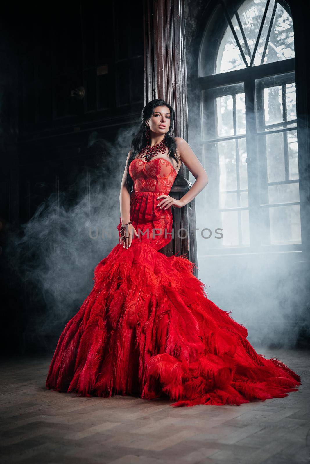 Woman Vintage Red Dress Old Castle Beautiful Princess In Seductive Dress Elegant Caucasian Female Fairy Tale story Near Big Window With Smoke Fog