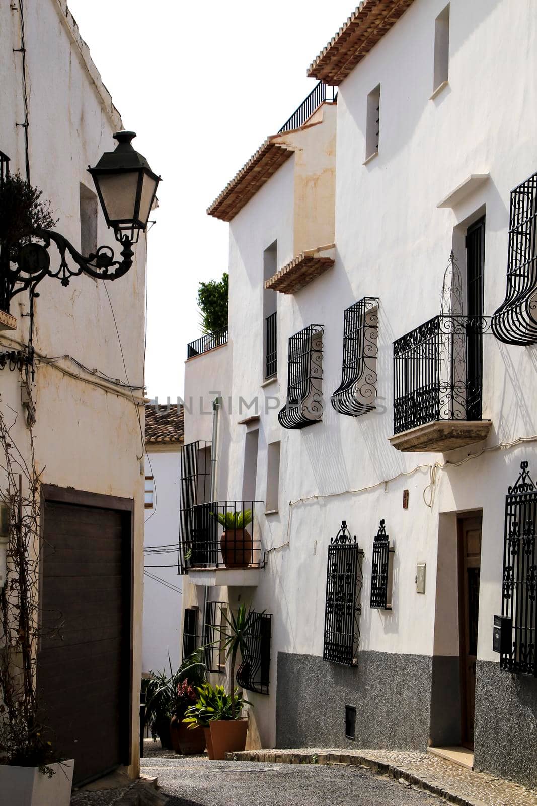 Narrow streets and beautiful whitewashed facades in Altea village, Alicante, Spain