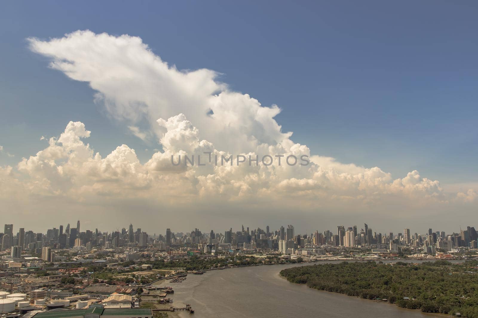 Bangkok, Thailand - Jun 03, 2021 : Beautiful curve of the chao phraya river in the afternoon time. Good time of the day, Nice city view, Selective focus.