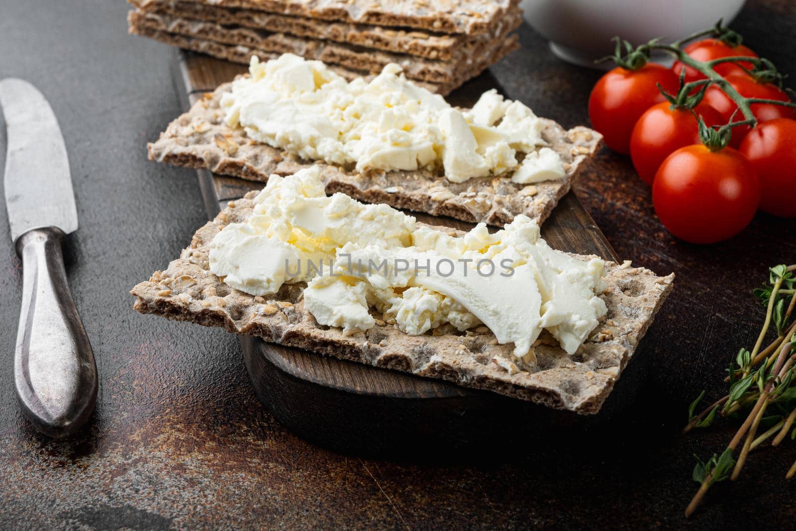 Crisp bread sandwich set, on old dark rustic table background