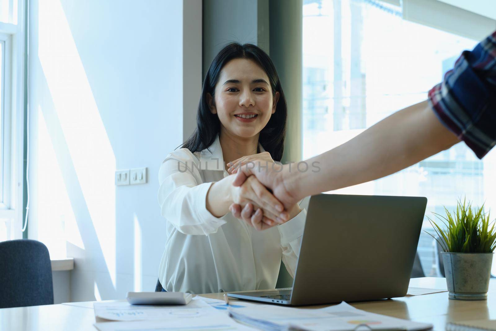 Business partnership meeting concept. Image businessmans handshake. Successful businessmen handshaking after good deal. Group support concept. by itchaznong