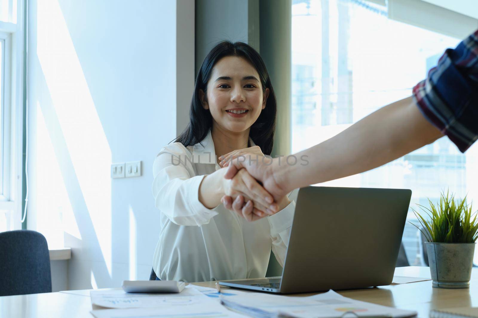 Business partnership meeting concept. Image businessmans handshake. Successful businessmen handshaking after good deal. Group support concept