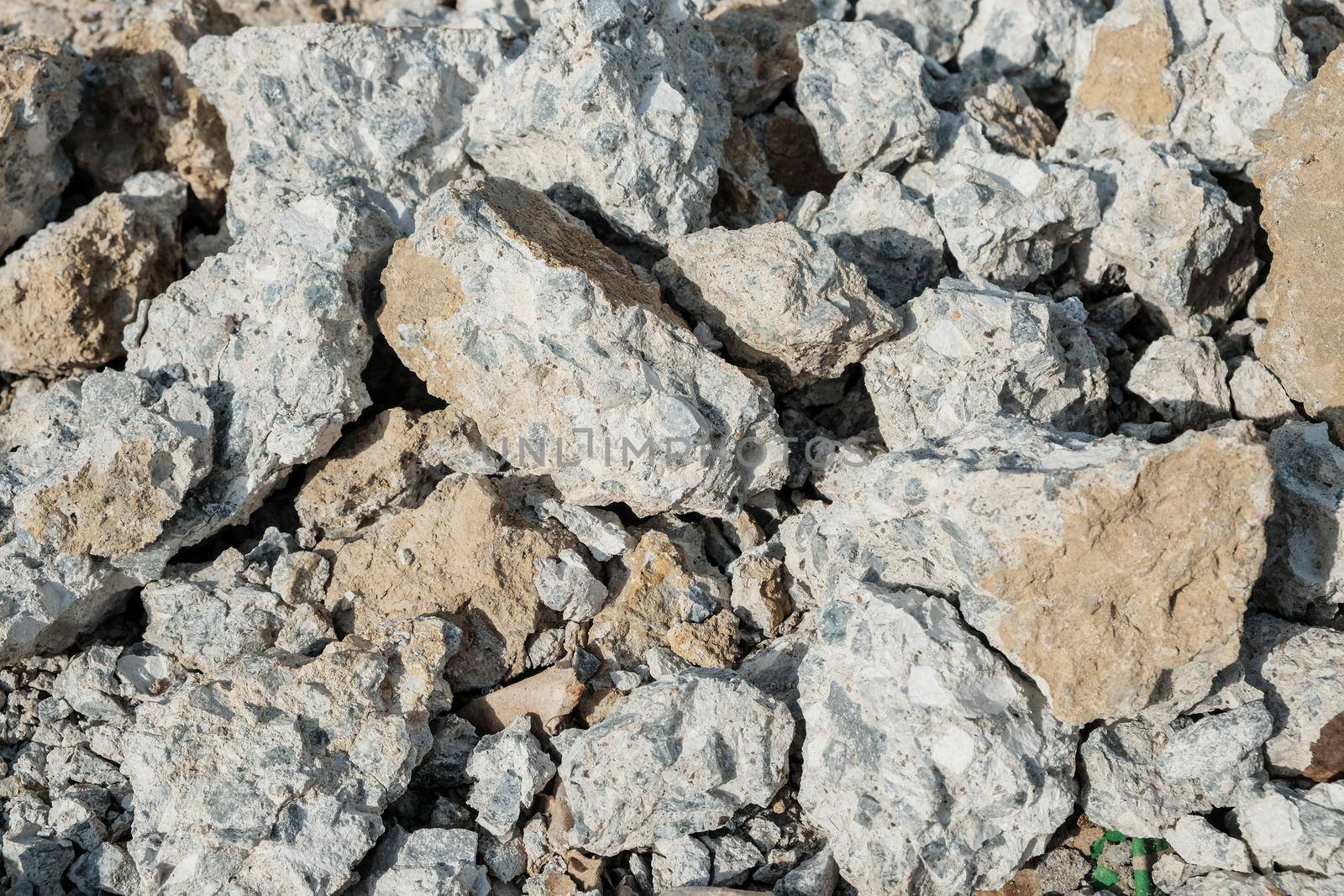 Large concrete stones. Construction waste after dismantling the old building. Close-up.