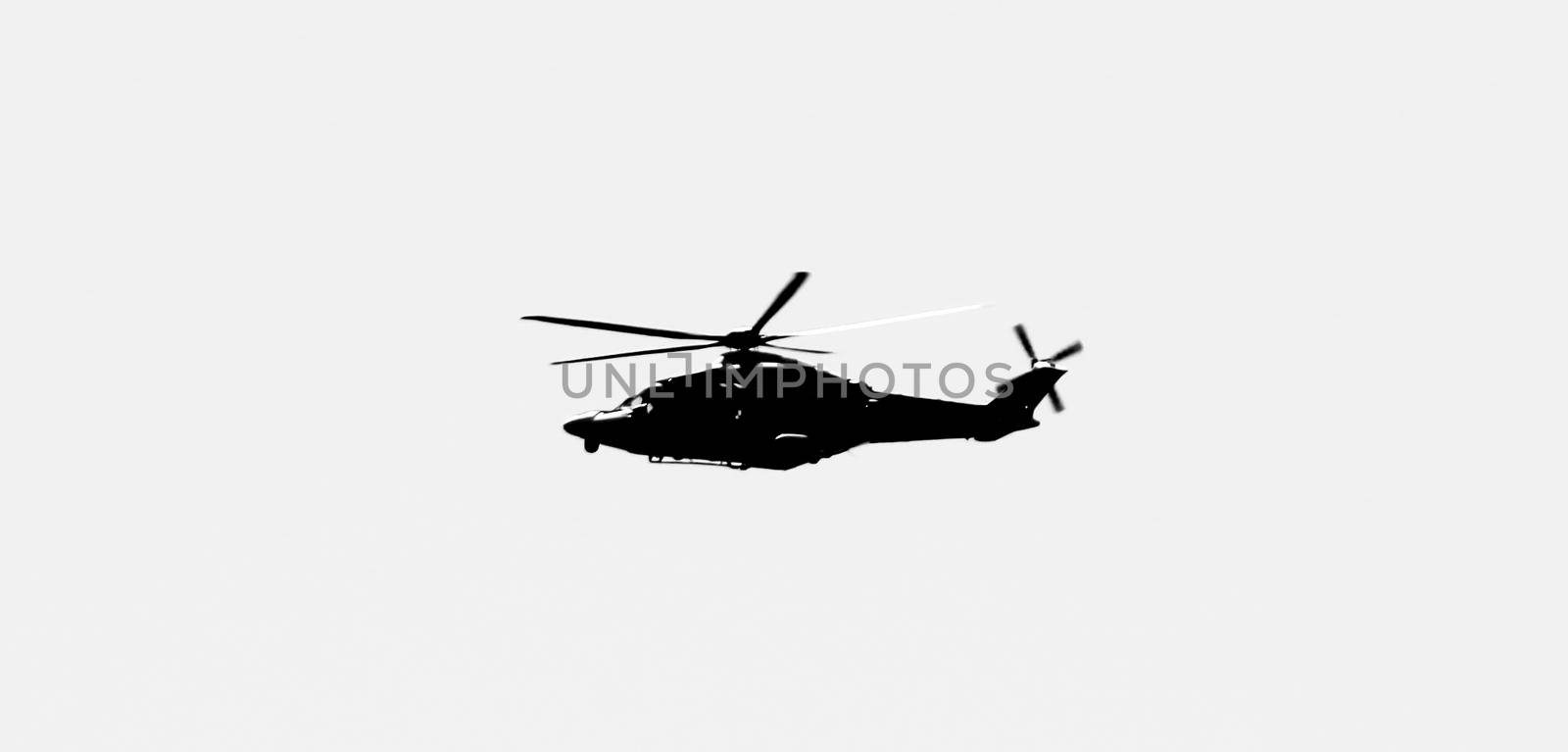 Military helicopter flying over the sky of the Spanish coast by soniabonet