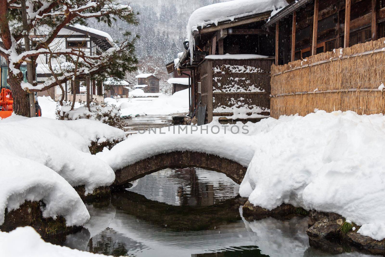 Shirakawago village with snow fall in winter season . Landmark of Gifu , Takayama , Japan .