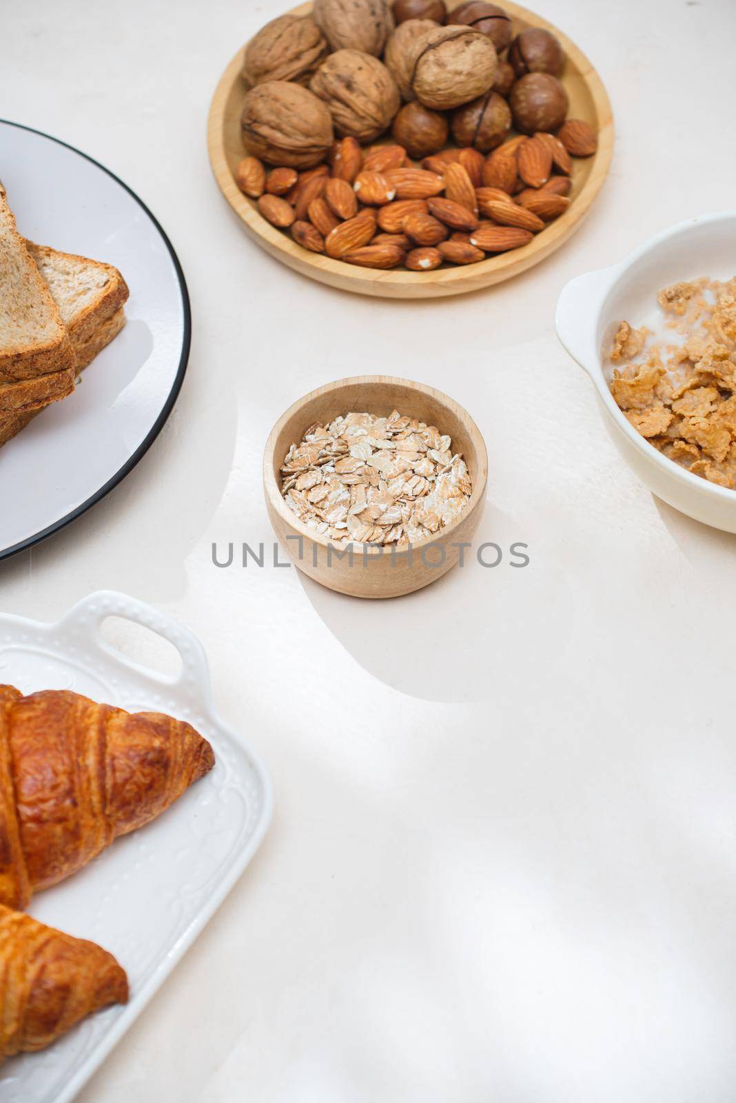 Health and colorful breakfast - waffles, muffins, almond, hazelnuts, various fresh fruits on table. Health food concept .Top view.