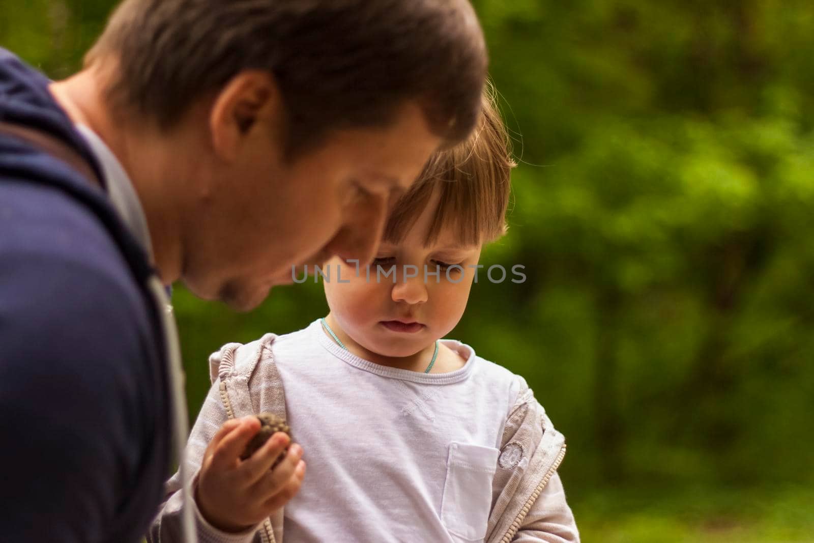 The father takes care of his little son. Father and child. Baby care, paternity, custody.