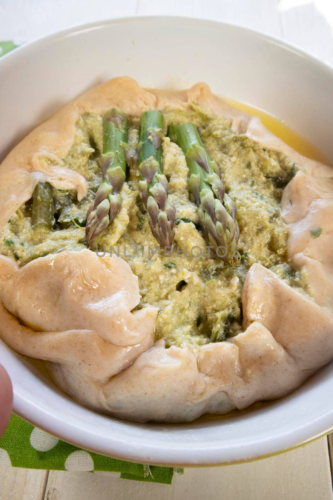 Vegan savory pie made with spelled flour and asparagus cream 