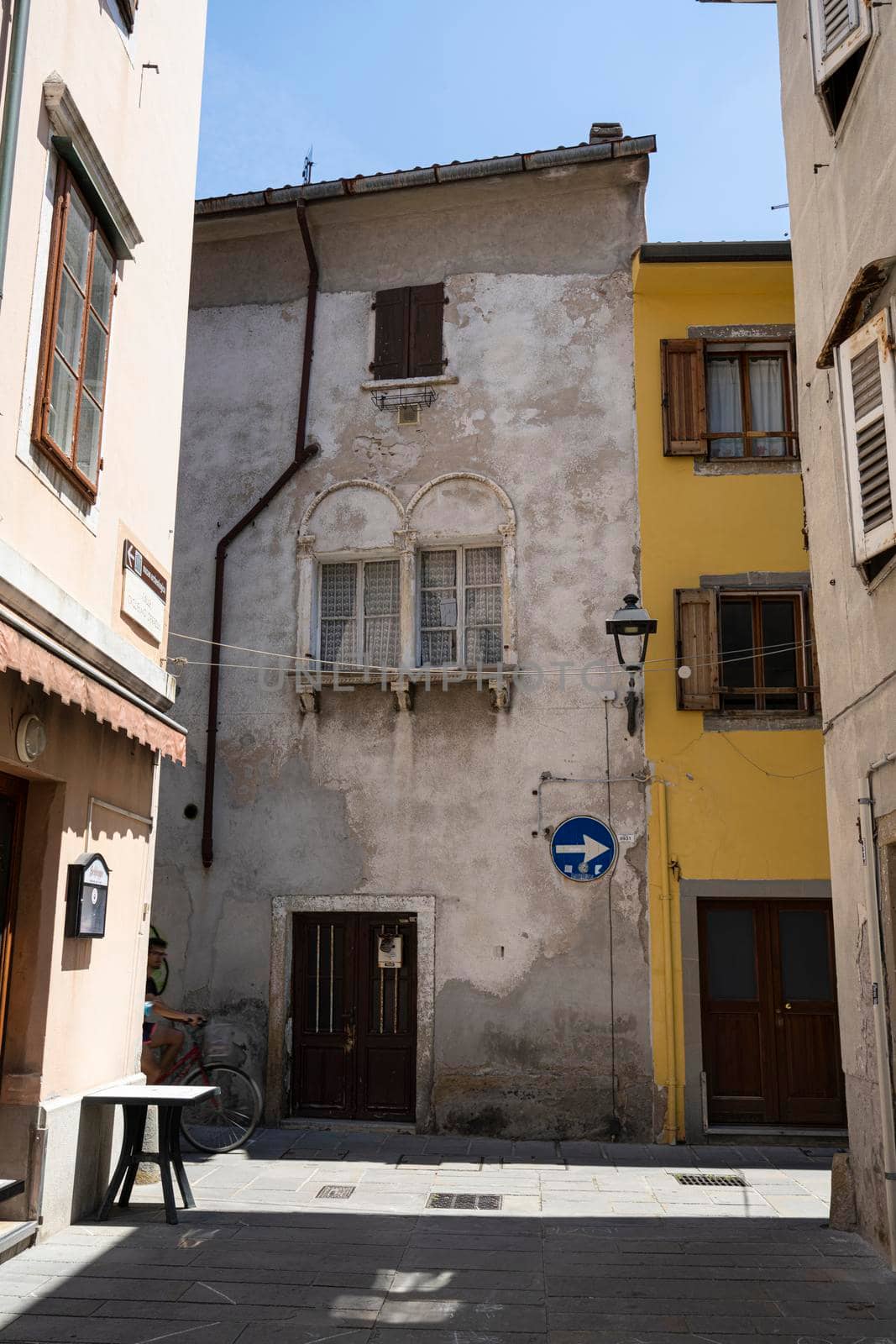 Muggia, Italy. June 13, 2021.  An ancient house in the historic center of the town
