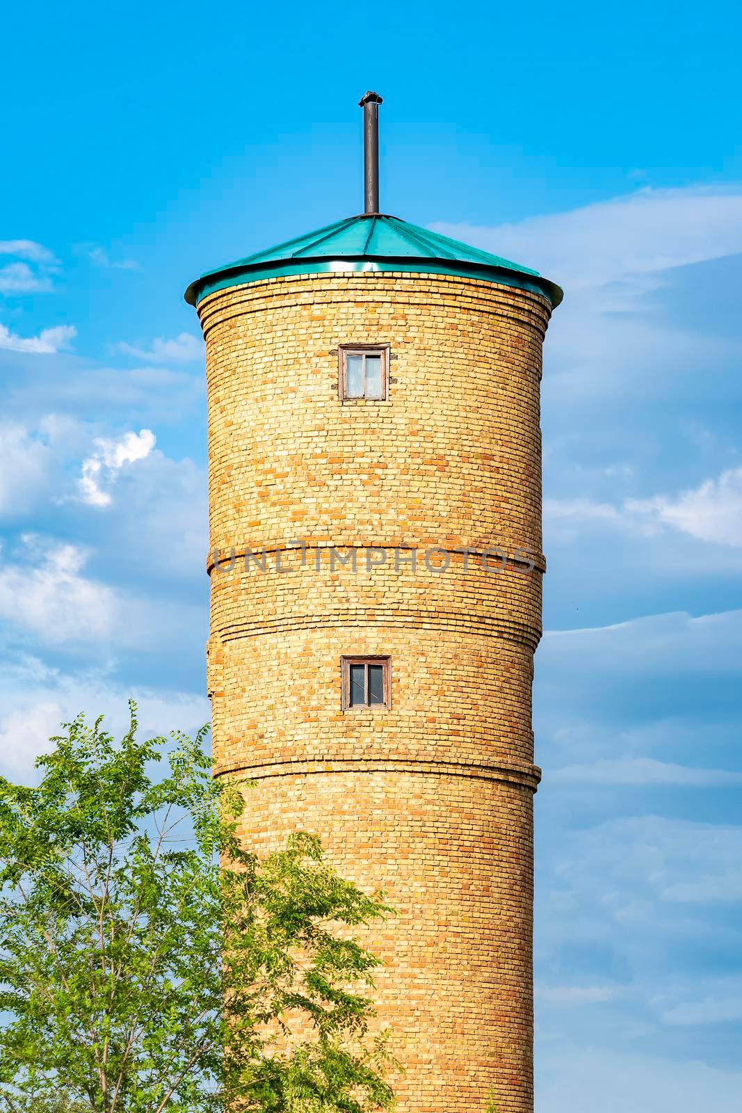 Water tower of artesian well. Outdoors, day light front view. by Essffes