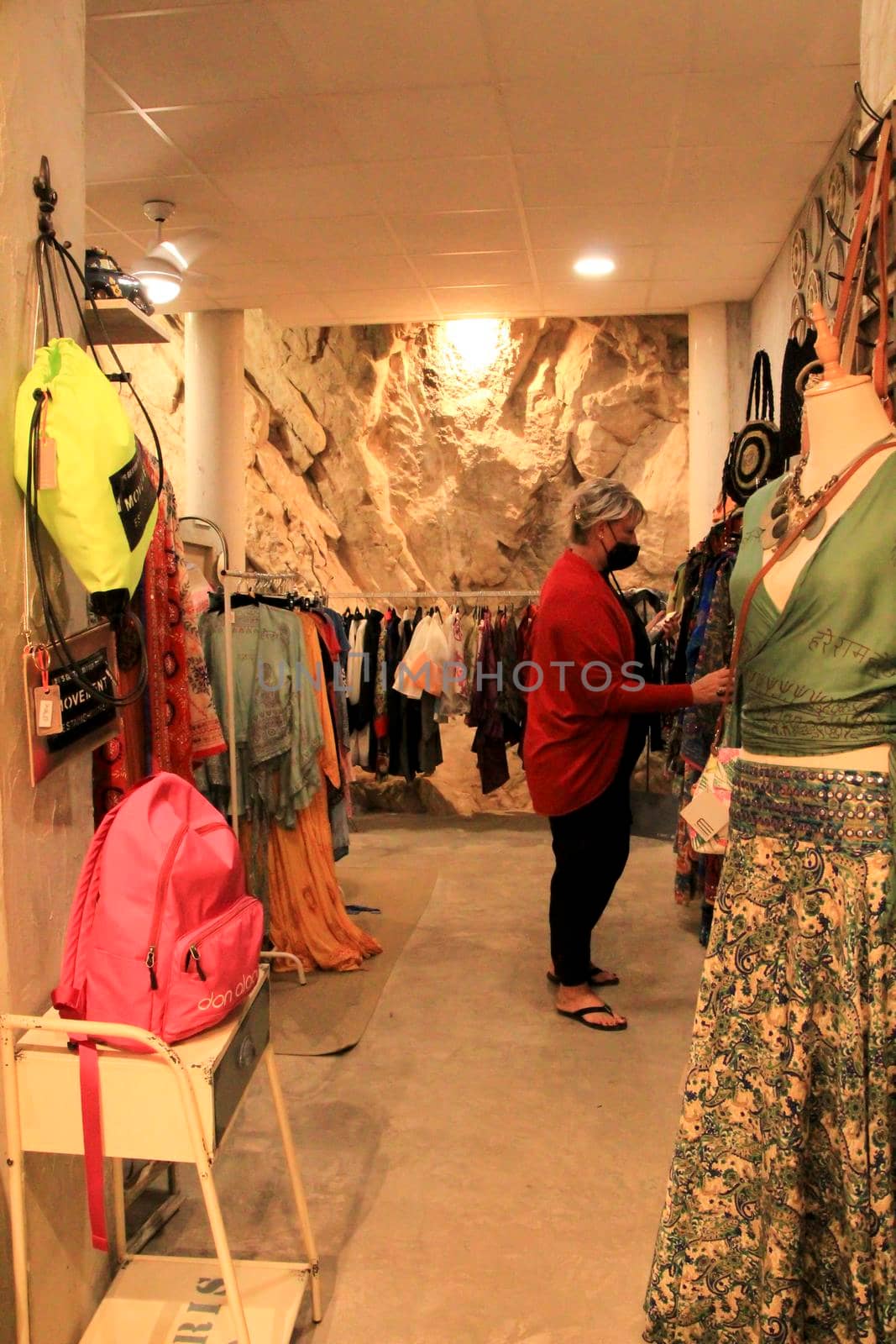 Altea, Alicante, Spain- June 12, 2021: People shopping at Handicraft and clothing store in Altea village, Spain