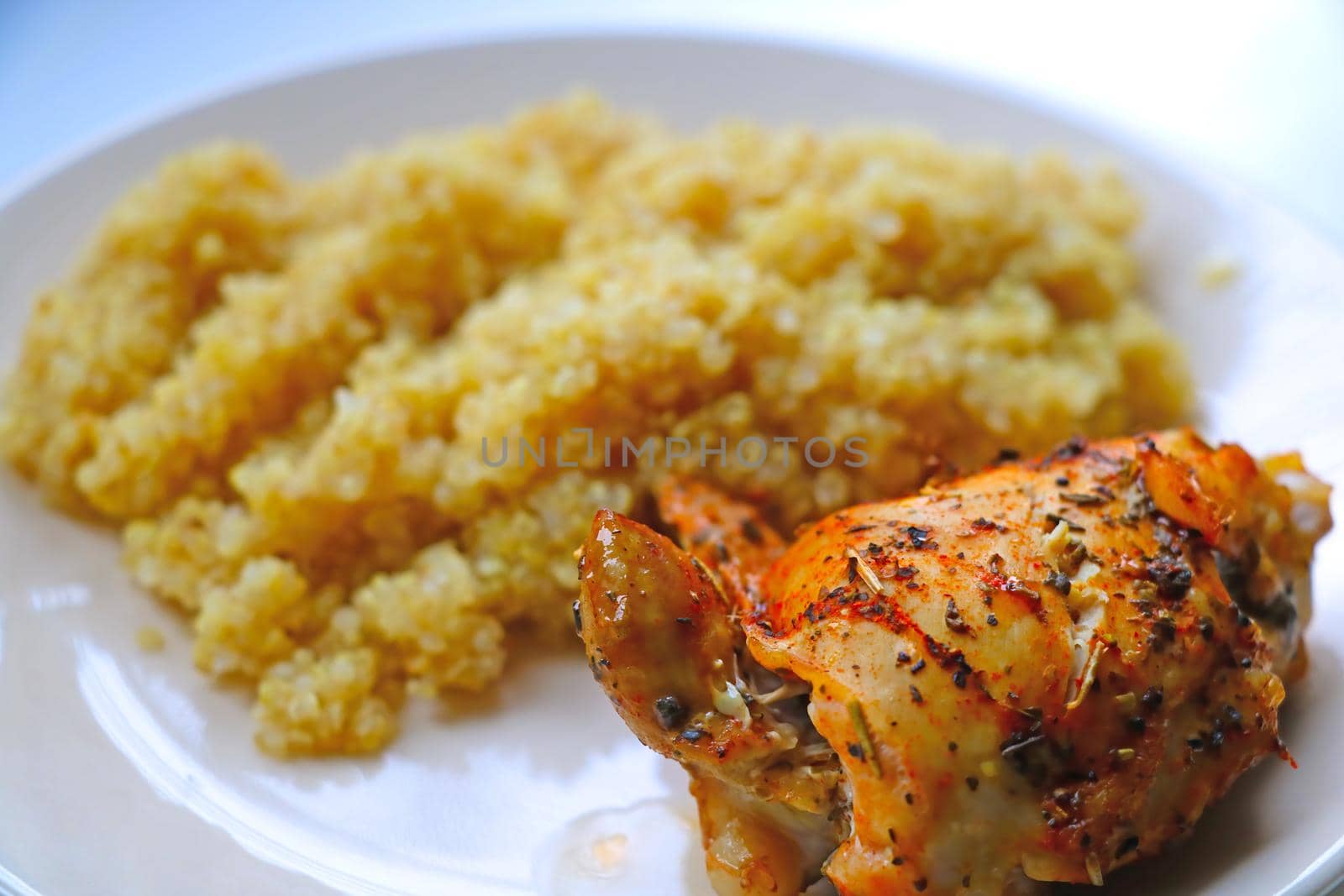 A piece of baked chicken with porridge on a light plate. A light and healthy lunch. Healthy eating. by kip02kas