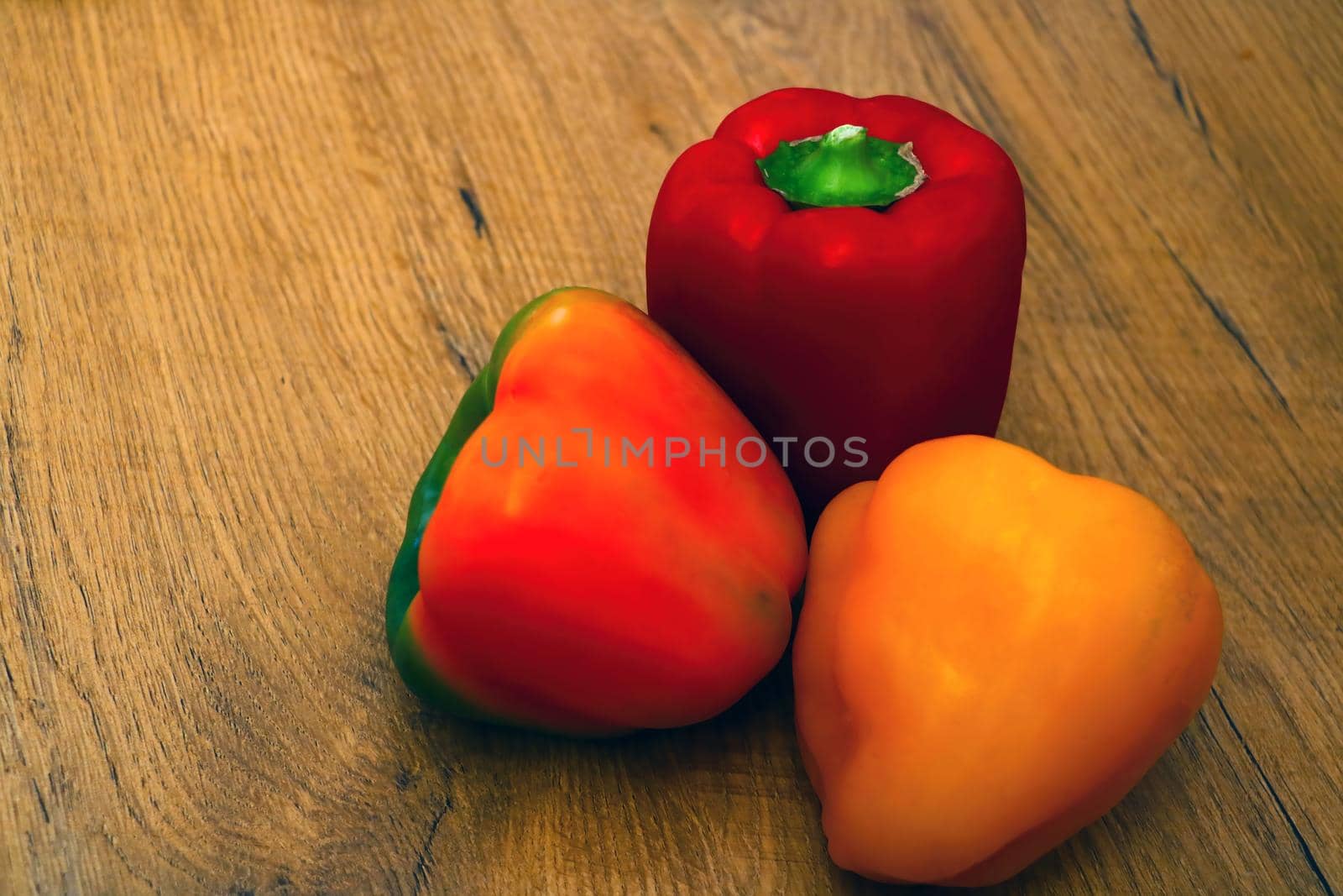 View of fresh multi-colored peppers on the table. Healthy vegetables, healthy food, diet. by kip02kas