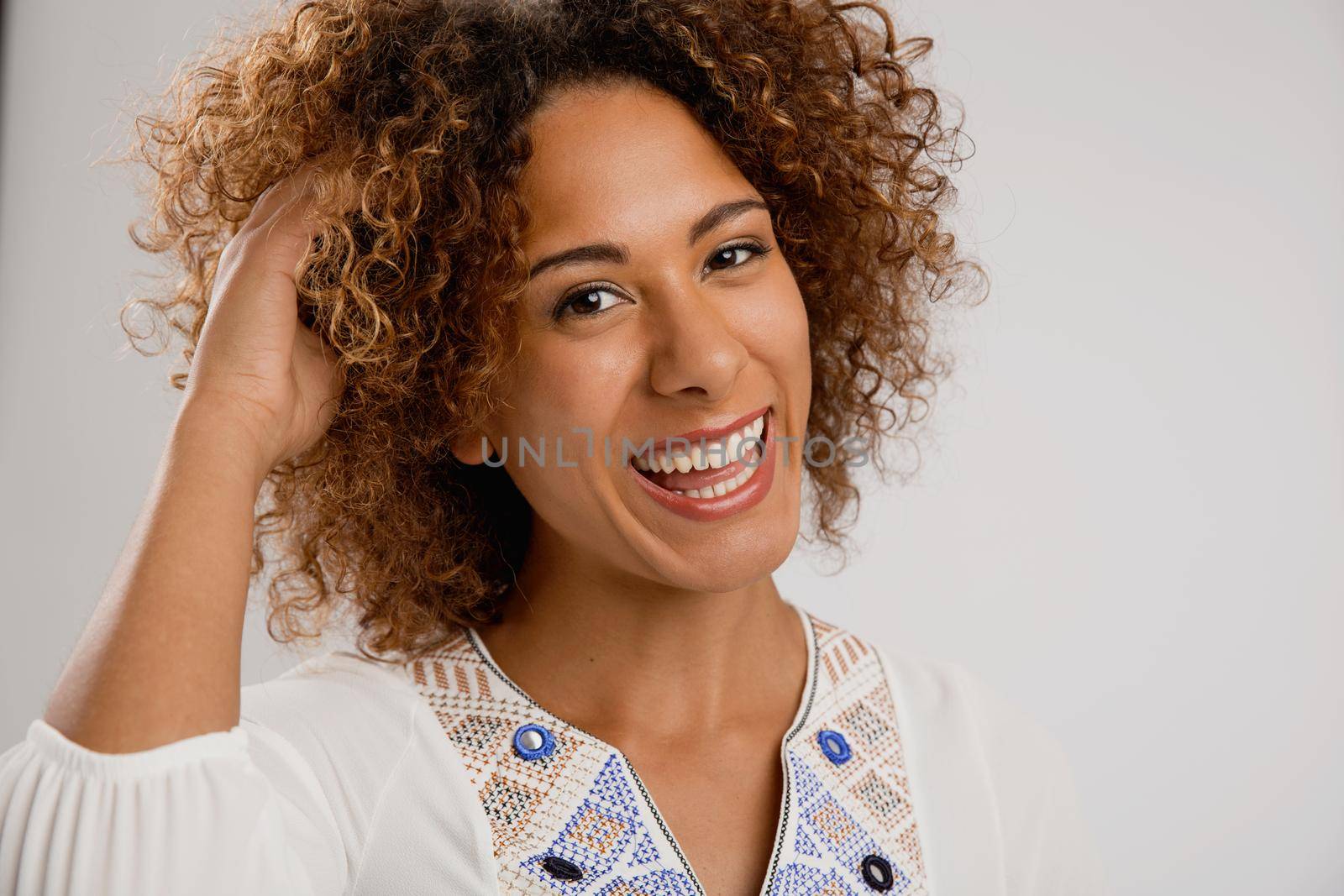 Beautiful African American woman smiling by Iko