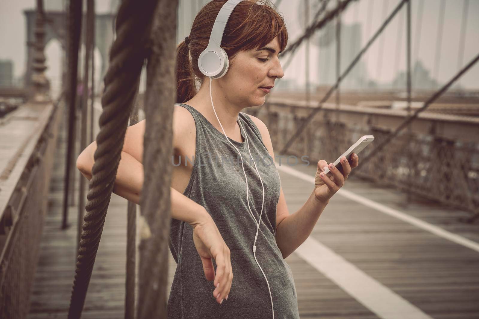 Woman resting after exercise on Brooklyn Bridge