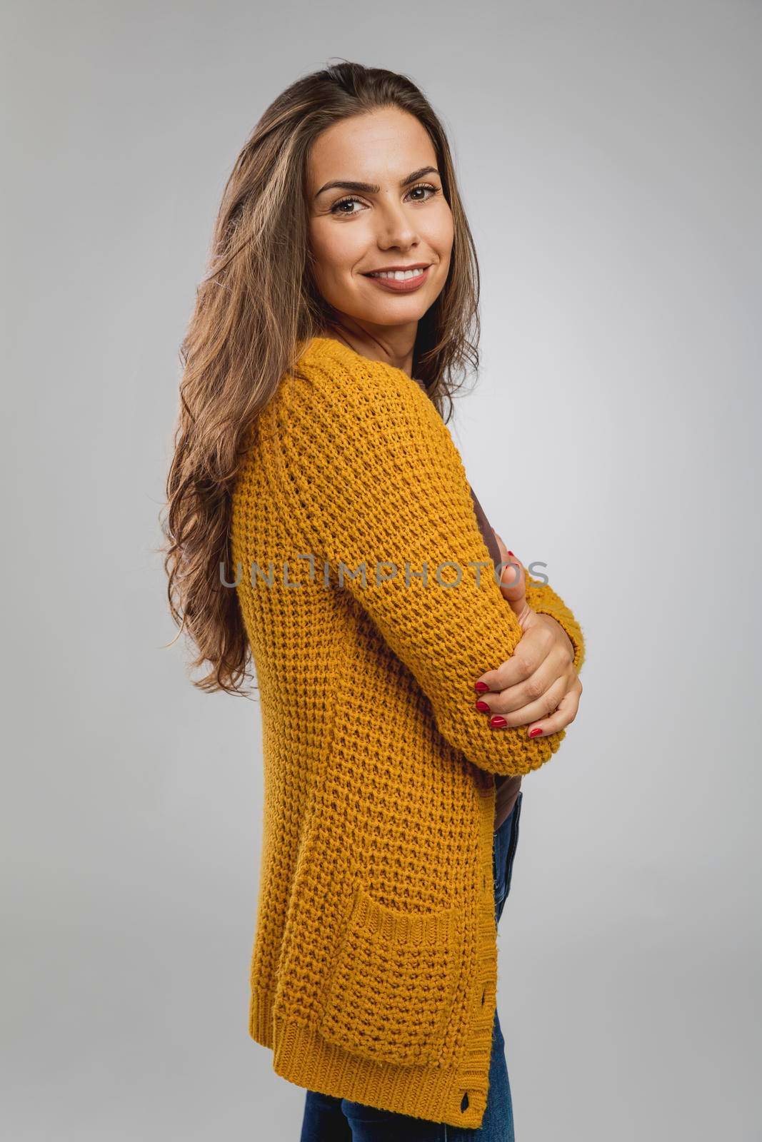 Shot of a beautiful young woman over a gray background