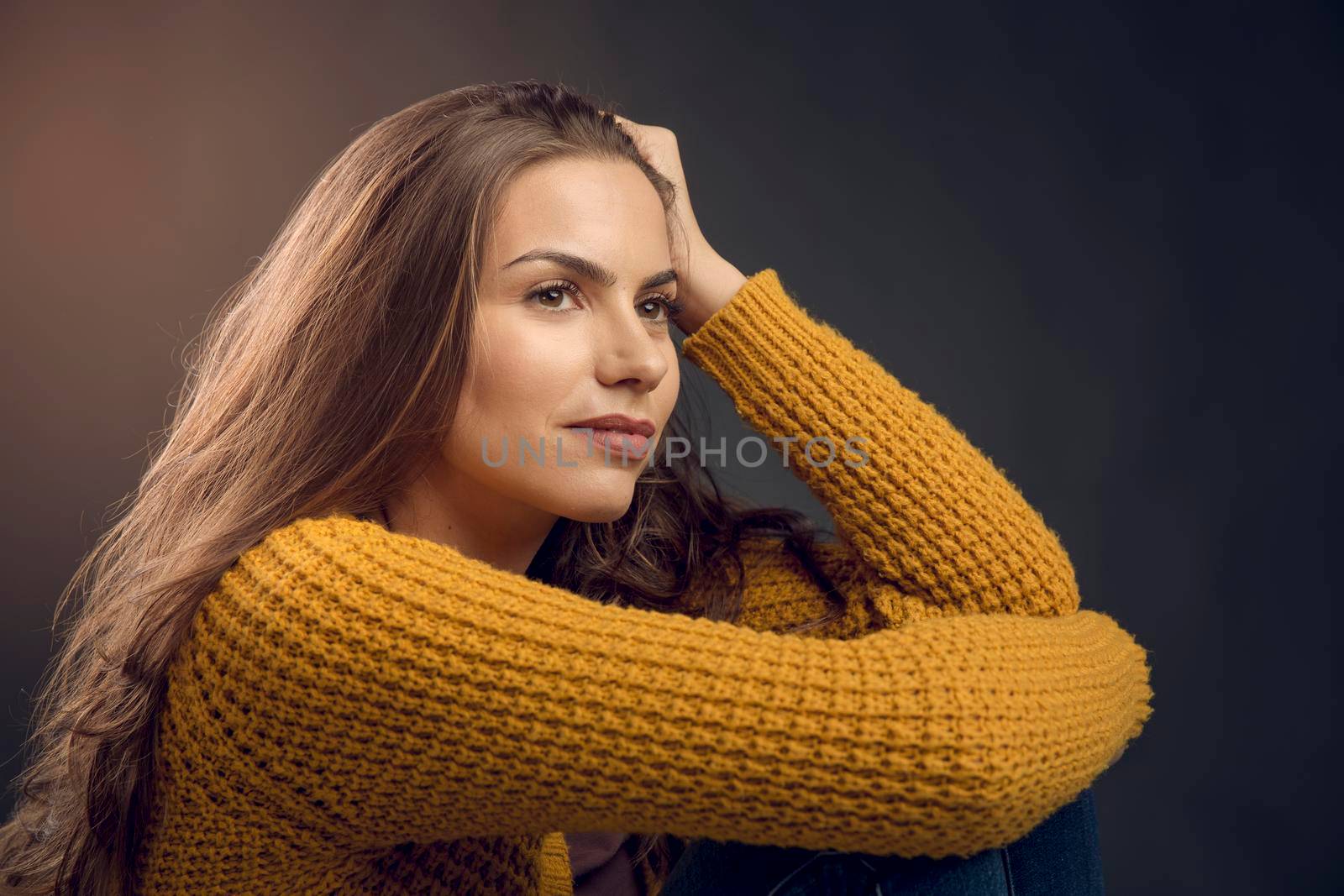 Shot of a beautiful young woman lost in thoughts