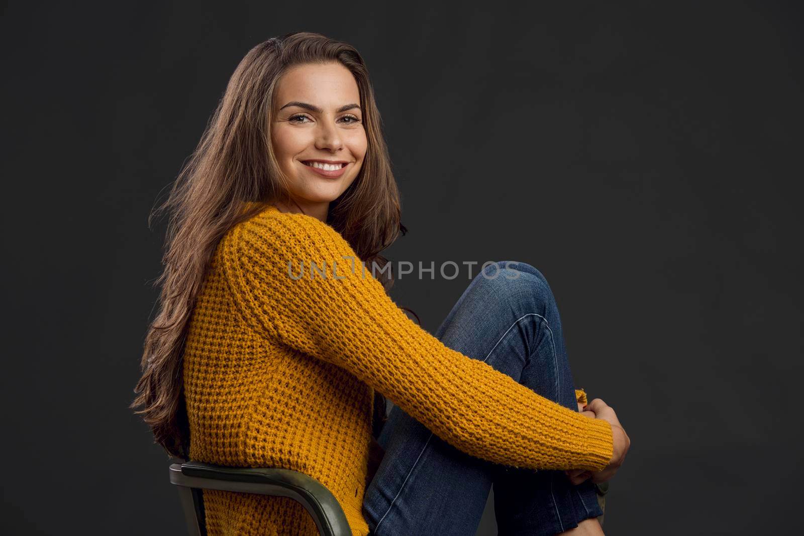 Shot of a beautiful young woman looking to the camera and smiling